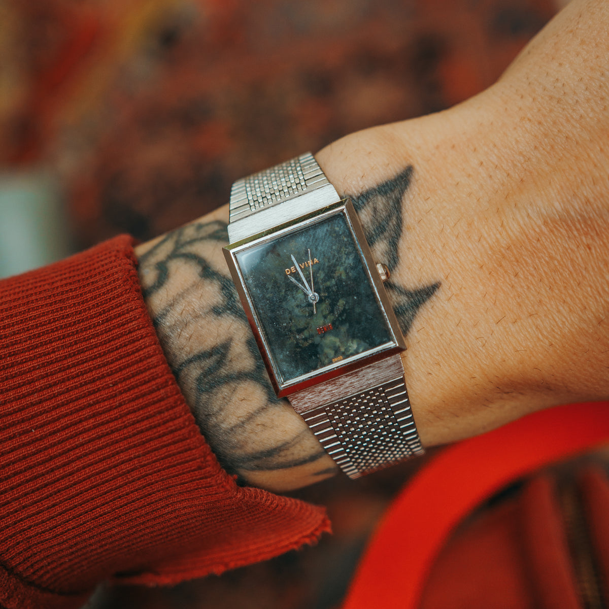 Delvina custom serpentine stone dial quartz watch on wrist