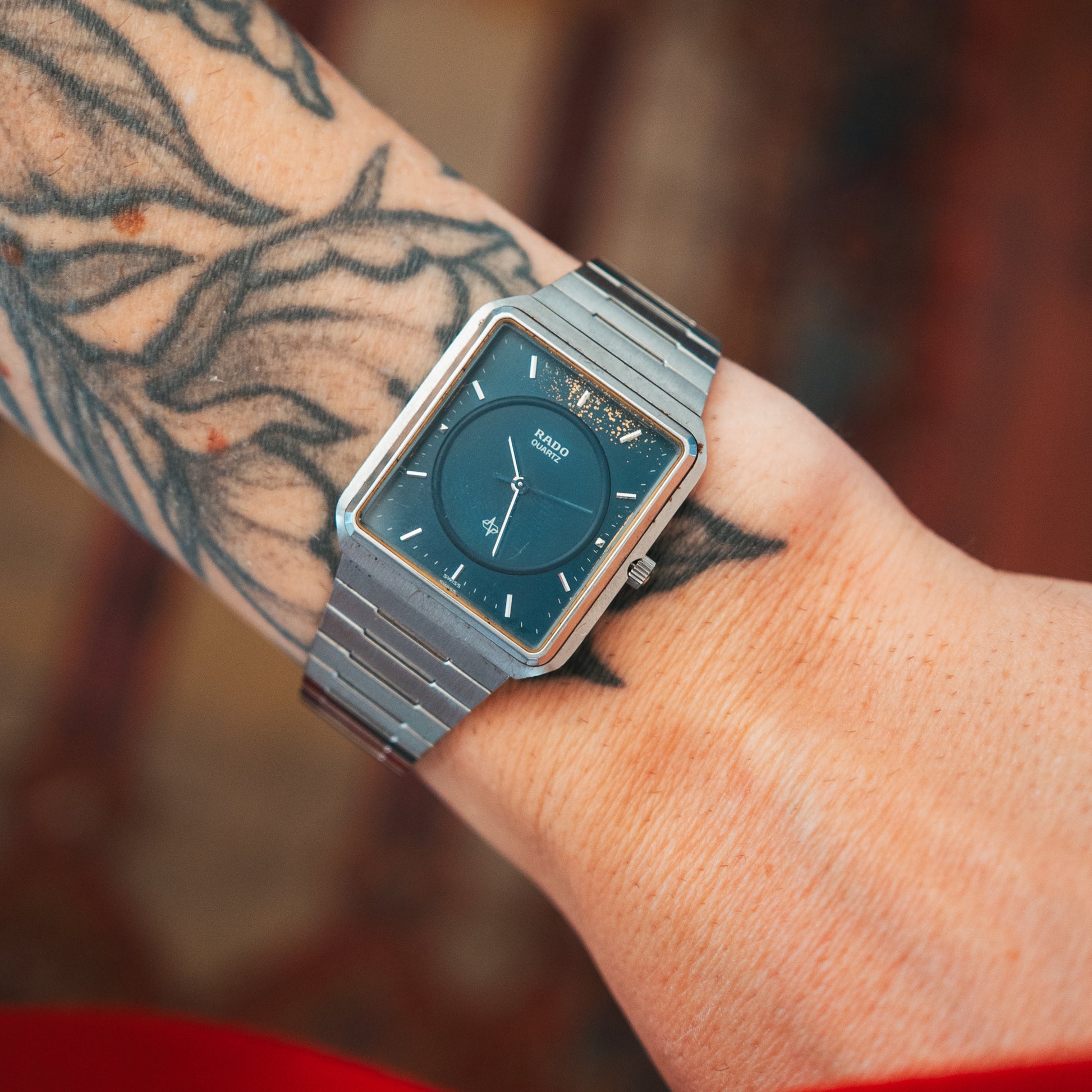 Rado Quartz teal dial on wrist front view