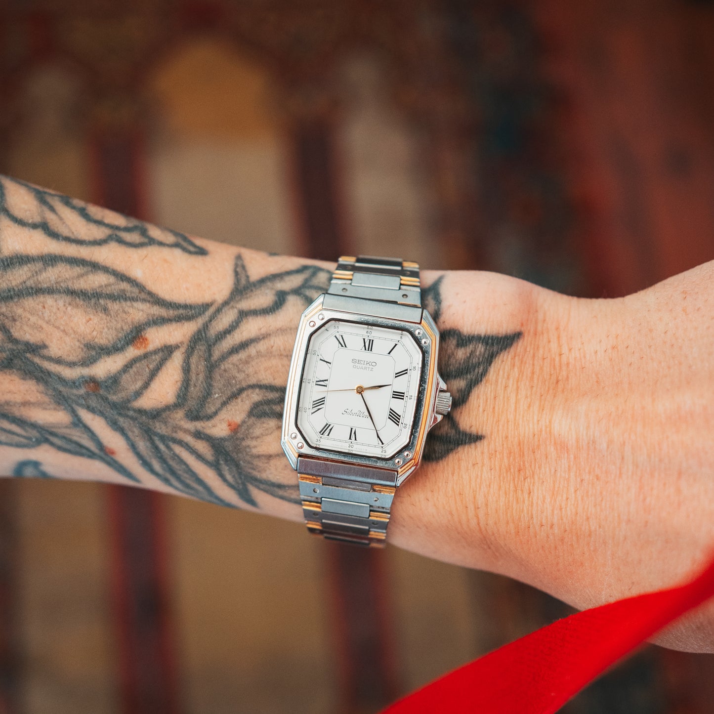Seiko Silver Wave two-tone Roman numeral dial on wrist front view