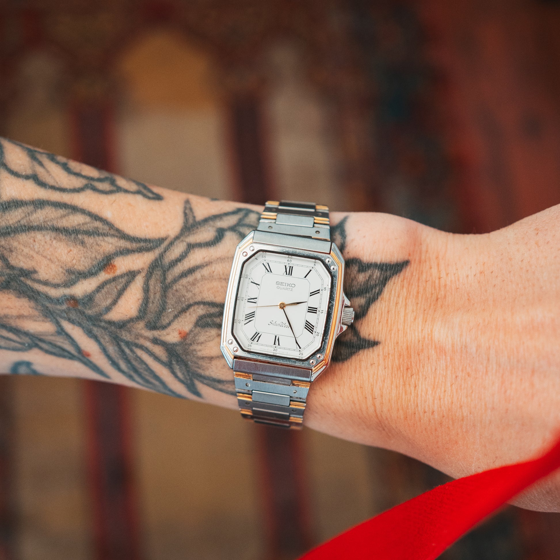 Seiko Silver Wave two-tone Roman numeral dial on wrist front view