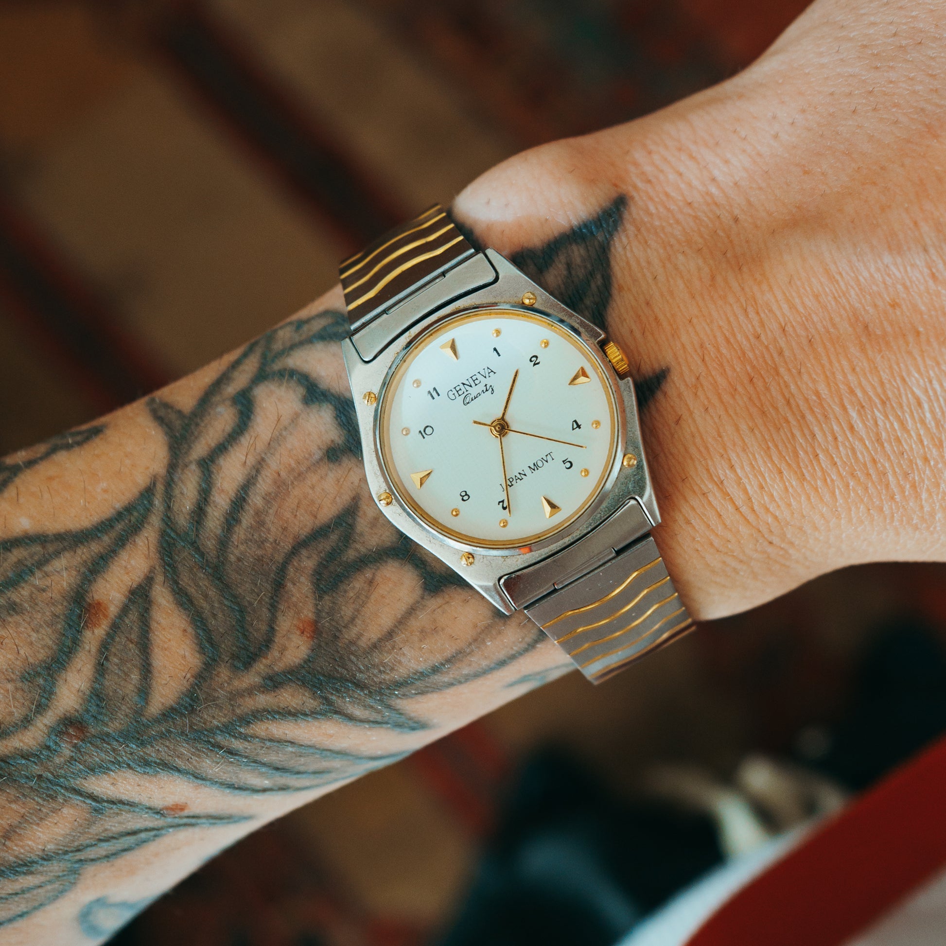 Geneva Quartz two-tone wave bracelet front view on wrist