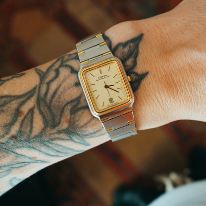 D'Homme Quartz two-tone champagne dial front view on wrist