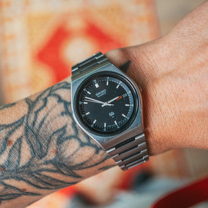 Seiko SQ Sport black dial wrist shot
