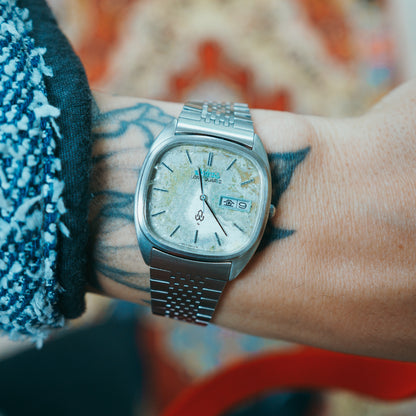 Seiko Lord Quartz Mossy Dial - caseback view on wrist