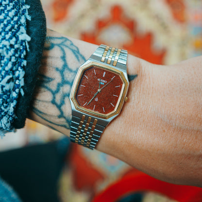 Seiko Red Garnet - red garnet dial with octagonal gold bezel on wrist