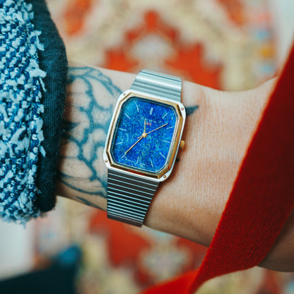 CYMA Blue Lapis - blue lapis dial with gold hands and two-tone case on wrist