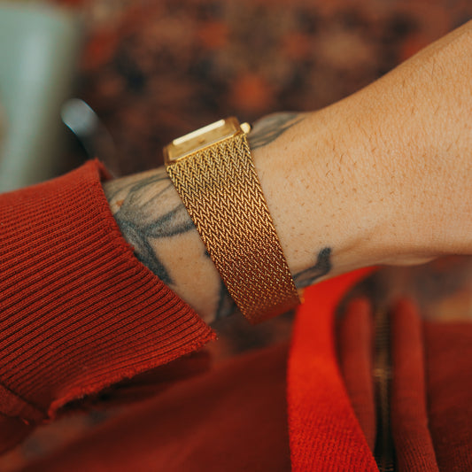 Citizen Woven Sauce rectangular quartz watch face on wrist