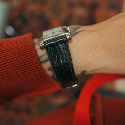 Rotary watch black strap and buckle on wrist