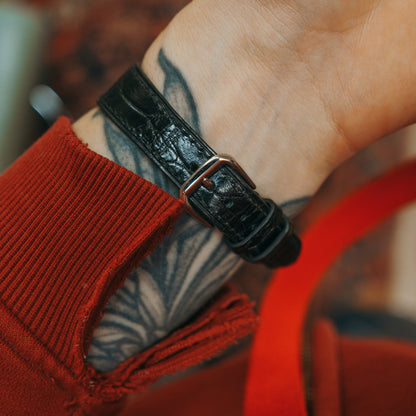 Rotary watch black strap side view on wrist