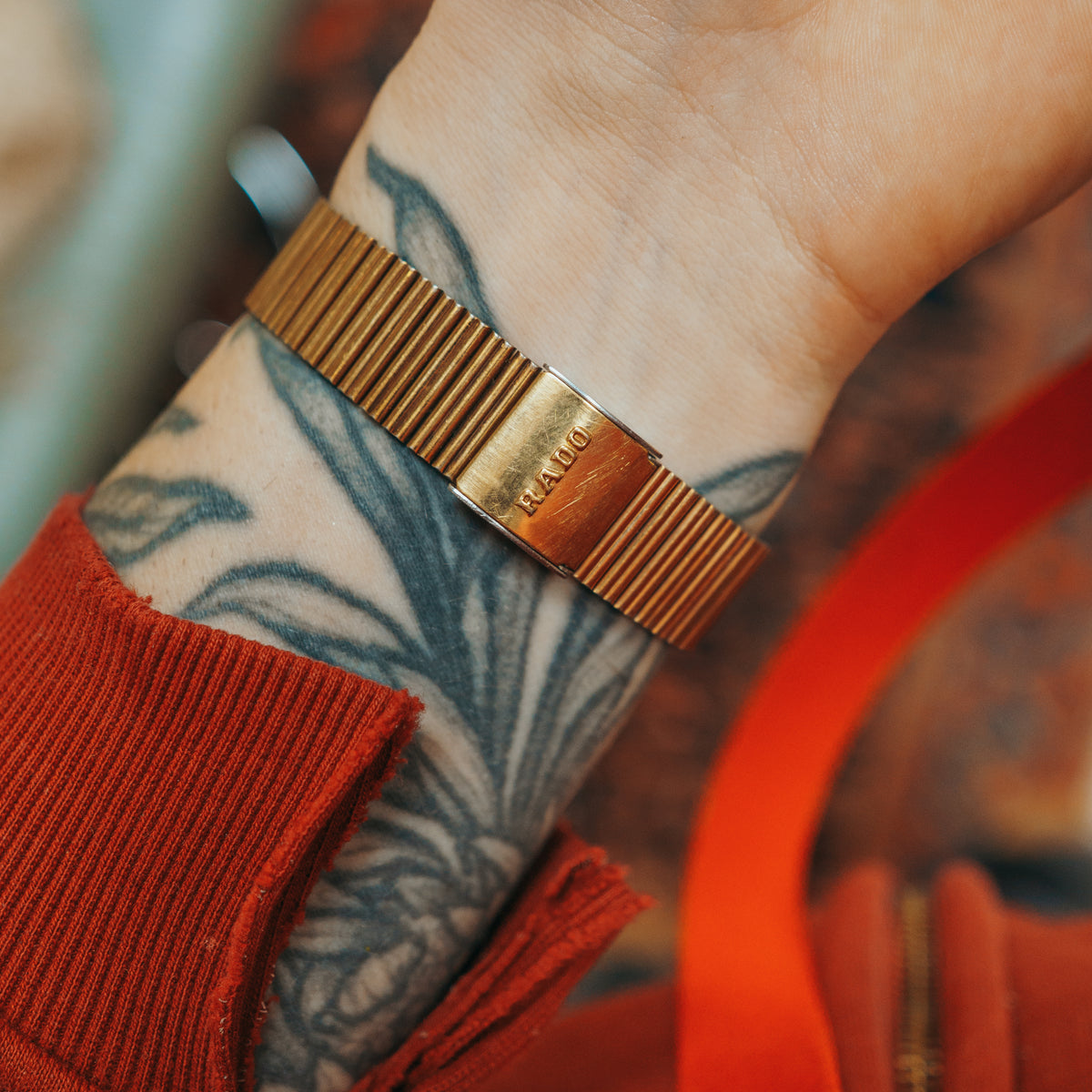 Rado Quartz gold-tone bracelet side view on wrist