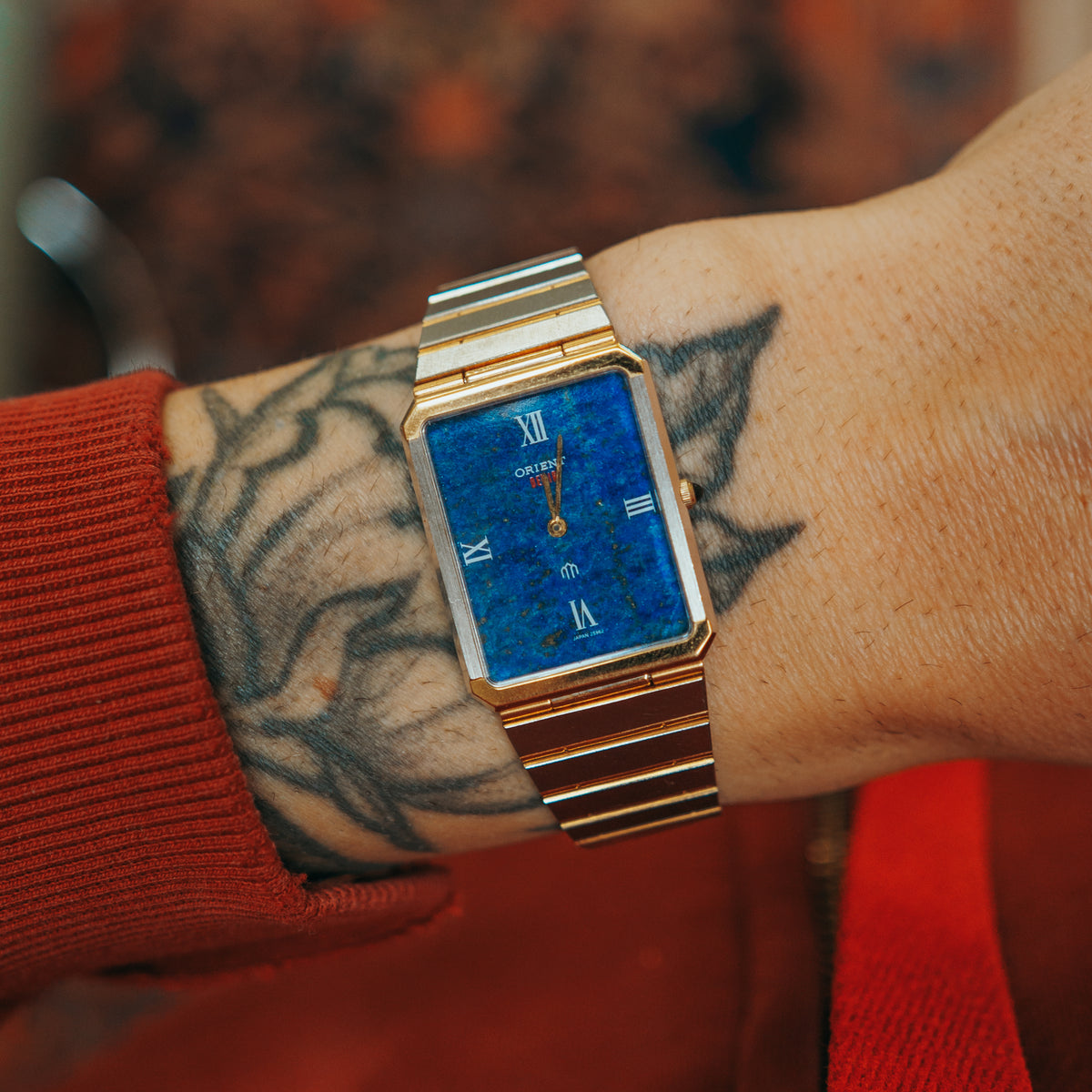 Orient Two Tone Lapis Dial bracelet on wrist