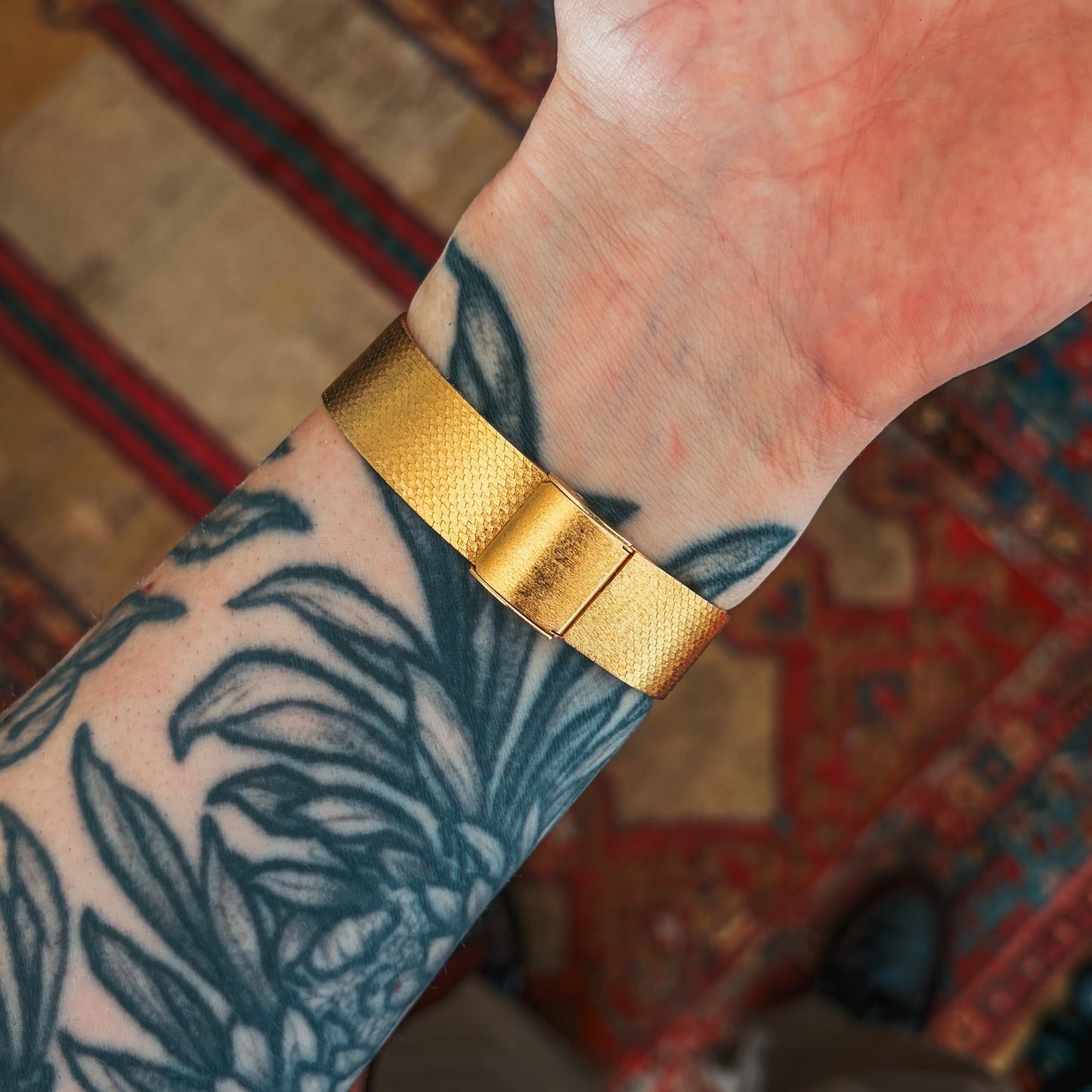 Phinix Swiss Mechanical gold bracelet clasp detail on wrist